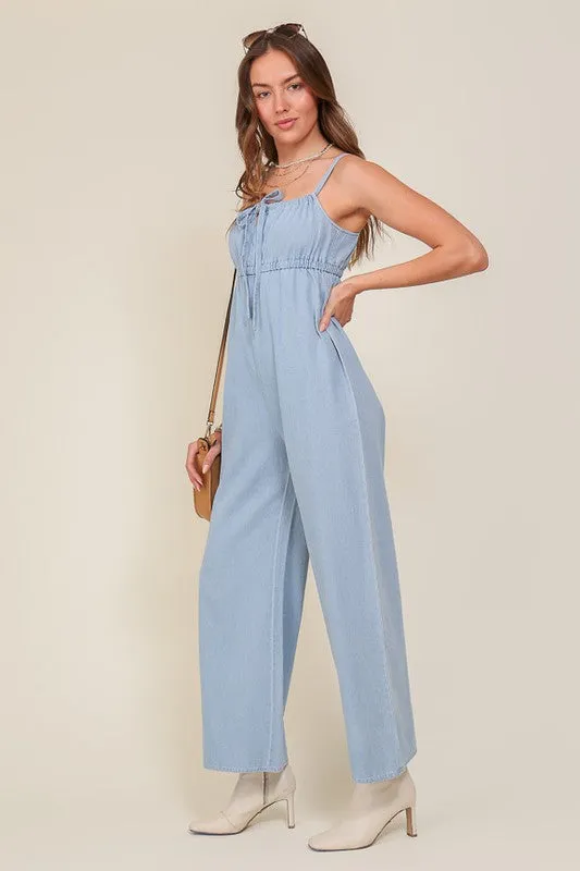 DENIM BLUE SLEEVELESS JUMPSUIT WITH SELF FRONT TIE